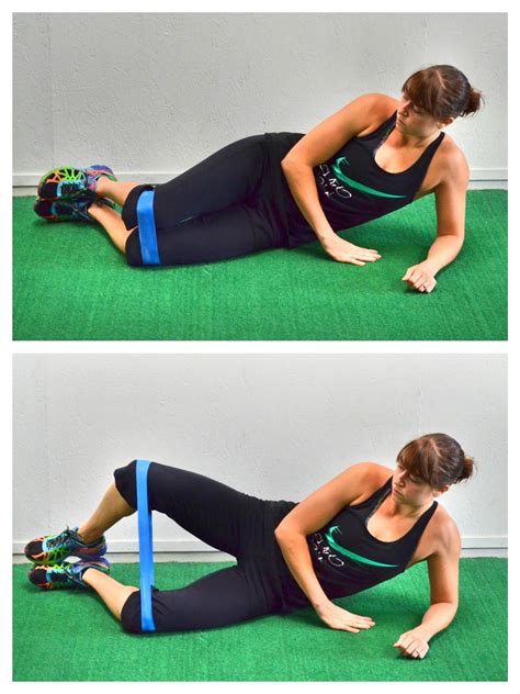 a woman is doing an exercise on the ground