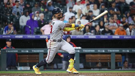 Braves' Ronald Acuña Jr knocked over in wild scene at Coors Field as ...