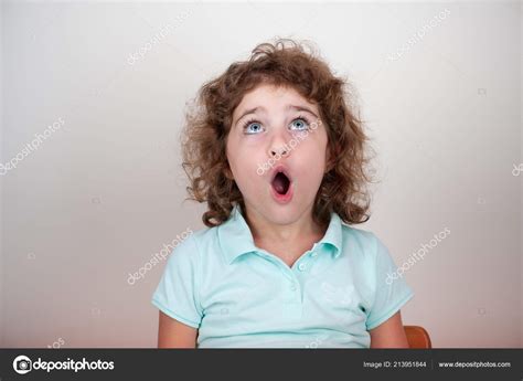 Young Child Surprised Looking Stock Photo by ©vereenna 213951844