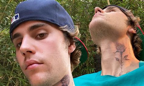 Justin Bieber gets a full-stemmed rose tattooed on his neck by renown LA-based ink master Dr ...