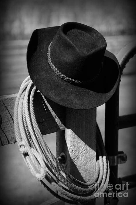 Cowboy Hat On Fence Post In Black And White Photograph by Paul Ward