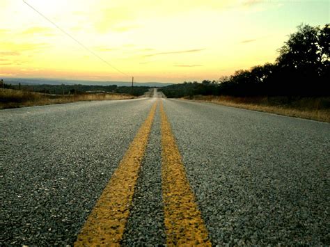 Sunset over a long straight road in the Texas Hill Country : r/pics