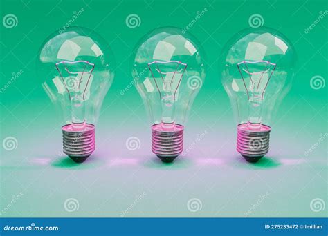 Three Retro Style Lightbulbs with Glowing Filament Standing in a Row on Infinite Colorful ...