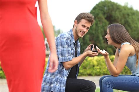 Unfaithful Man Looking Another Girl During Proposal Stock Photo - Image ...