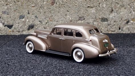 DIECAST MANIA • 1937 OLDSMOBILE L-37 TOURING SEDAN Issued by...