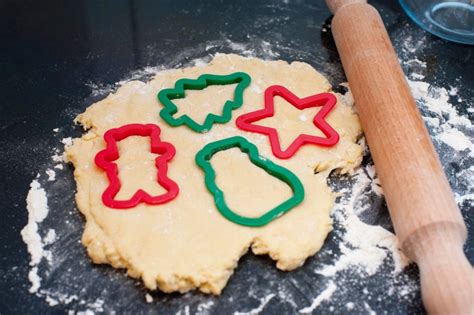 Rolled pastry dough with cookie cutters - Free Stock Image