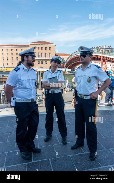 Three City of Venice police officers in Venice, Italy Stock Photo - Alamy