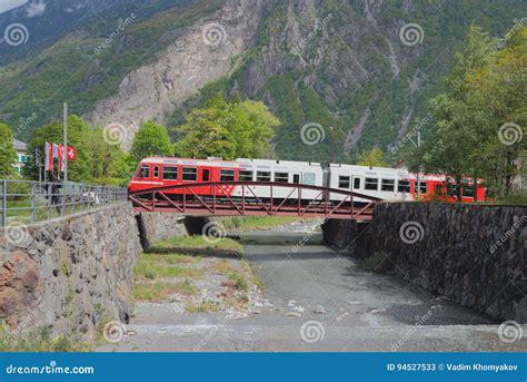 Train Going Along Bridge through River Trient. Vernayaz, Martigny ...