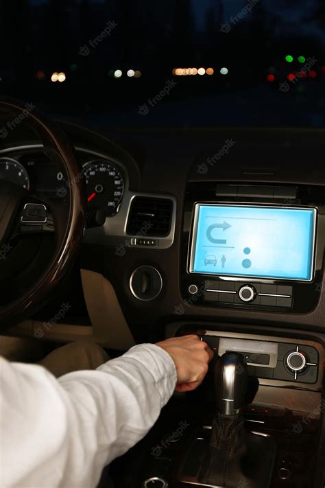 Premium Photo | Man driving his modern car at night in city closeup