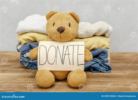 Stack of Baby Children Clothes,teddy Bear Toys.Donation,volunteering ...