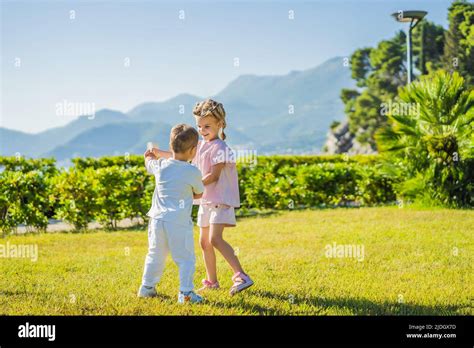 Portrait of two cute adorable baby children toddlers hugging and ...