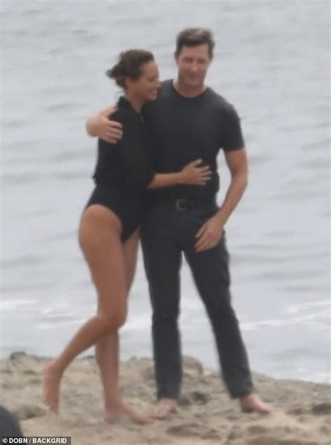 Christy Turlington, 50, cuddles with husband Edward Burns in one-piece ...