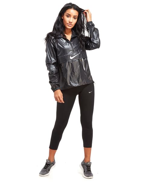 Nike Packable Swoosh Jacket | Nike rain jacket, Shiny jacket, Womens windbreaker