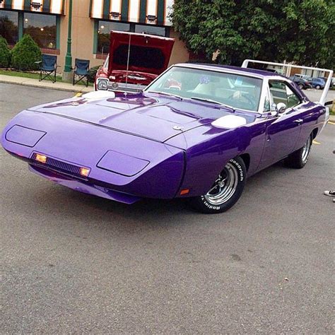 A beautiful Dodge Daytona pulled in. It's a clone, but it's done 100% ...