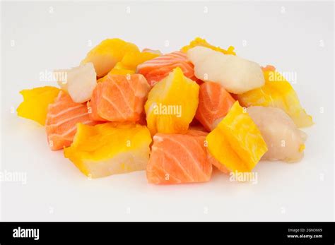 Mixed group of fresh raw salmon, cod and smoked haddock chunks prepared ...