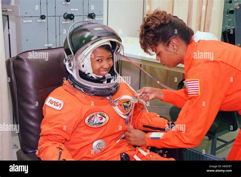 NASA STS-47 Spacelab-J mission astronaut Mae Jemison has her spacesuit checked for leaks prior ...