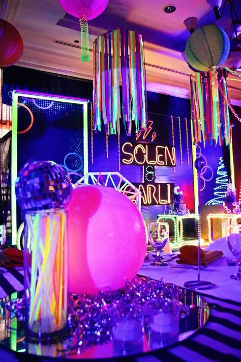 a room filled with lots of colorful lights and decorations