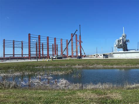 Falcon Heavy rocket hangar rises at launch pad 39A – Spaceflight Now