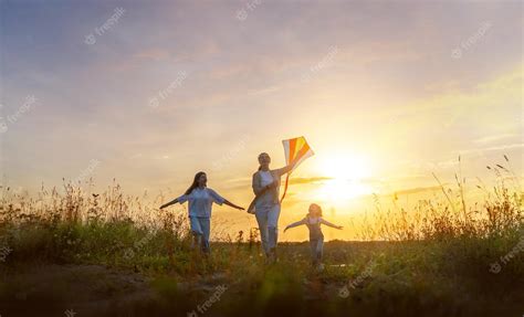 Premium Photo | Happy family at sunset