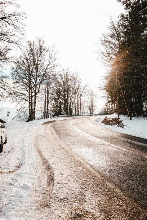 Snowy road and trees 1248134 Stock Photo at Vecteezy