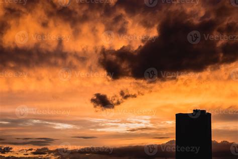 Dramatic orange sunset with building silhouette 8988928 Stock Photo at ...