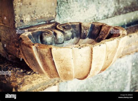 Holy water font. Religious symbol. Photo filter Stock Photo - Alamy