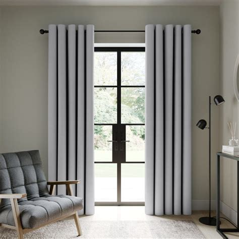 Berlin Soft Grey Blackout Eyelet Curtains | Dunelm