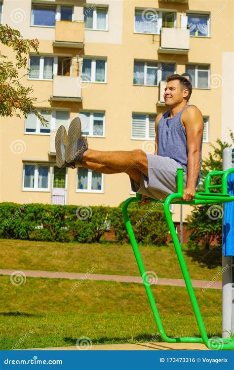 Man Doing Sit Ups in Outdoor Gym Stock Photo - Image of training, situps: 173473316