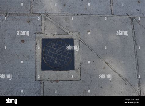 Thames Water stopcock road cover Stock Photo - Alamy