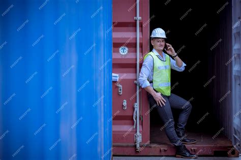 Premium Photo | Portrait team dock workers posing under working and checking production process ...