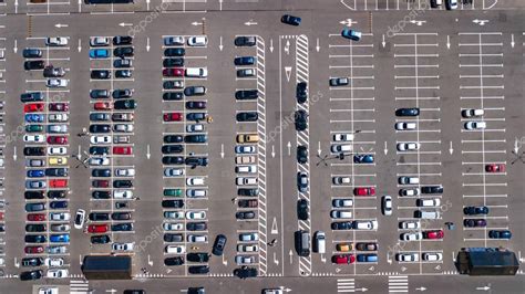 Aerial top view of parking lot with many cars from above ...