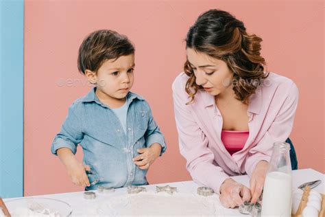 mother with cute little son cooking pastry together at white kitchen ...