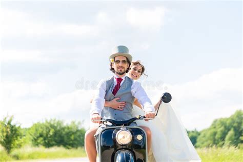 Bridal Pair Driving Motor Scooter Wearing Gown and Suit Stock Image ...