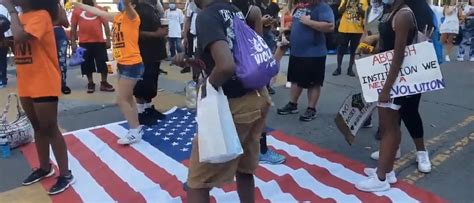 Black Lives Matter Protesters Filmed Dancing On American Flag In Washington, DC | The Daily Caller