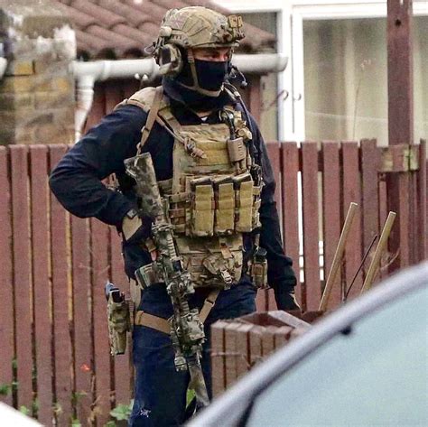 British Special Air Service (SAS) trooper armed with a L119A2 carbine during the Newcastle ...