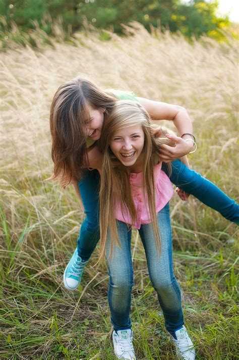 Best friends piggy back field teens outdoors summer fall girls jeans fun | Friend photoshoot ...