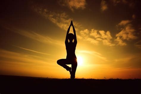 Premium Photo | A woman doing yoga in front of a sunset