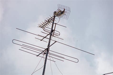 Old TV antenna in the sky stock image. Image of entertainment - 122430543