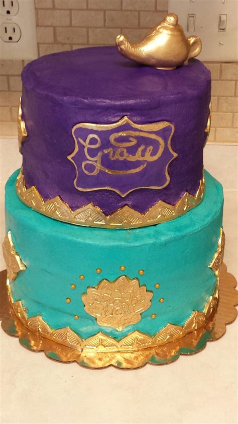 An Aladdin / Princess Jasmine themed cake. The figurine went on later. I used various molds for ...