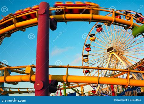 Amusement Park Rides on a Pier Editorial Stock Image - Image of tourism, color: 36731334