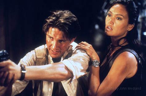 Christien Anholt and Tia Carrere in RELIC HUNTER by John Medland