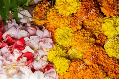 Pooja thali full of marigold and little flowers for pushpanjali ritual in Saraswati puja or ...