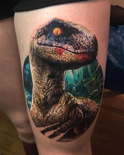 Great colorful dinosaur tattoo on thight by Tymur Denisenko ...