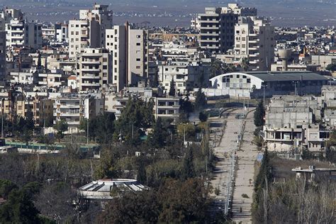 Syria: Shattered city of Homs returns to Assad control as fighters leave last rebel-held area