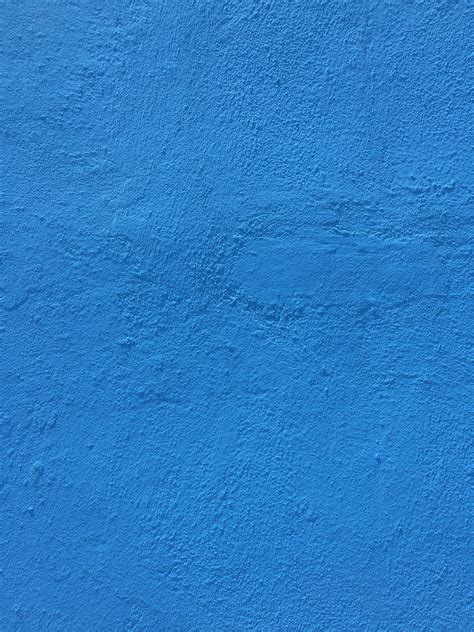 Bright blue paint over concrete wall | Free Textures