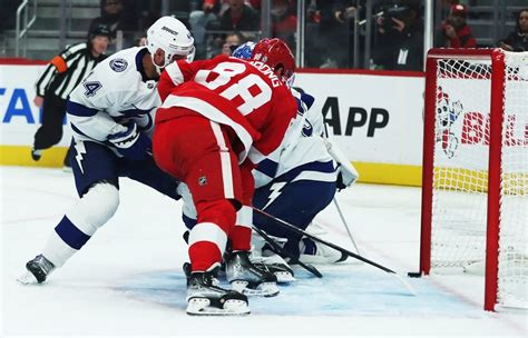 NHL: Alex DeBrincat scores twice, powers Red Wings past Lightning