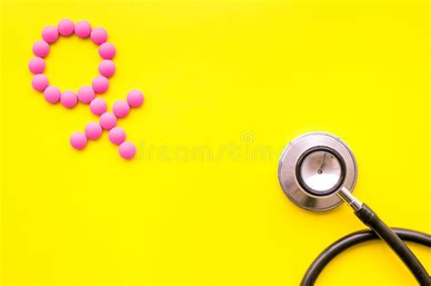 Female Diseases Concept. Stethoscope Near Female Sign on Yellow Background Top View Copy Space ...