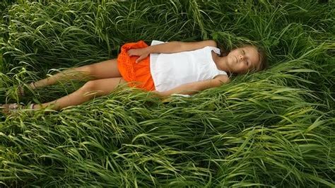 Little Girls Resting on the Green Grass. Beautiful Kids Lying on the ...