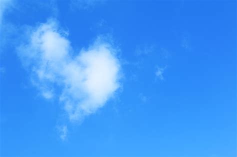 Premium Photo | Heart shaped clouds in the sky