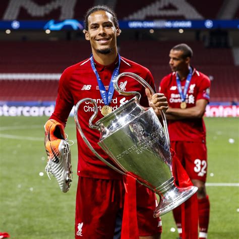 Virgil Van Dijk Holding Champions League Trophy